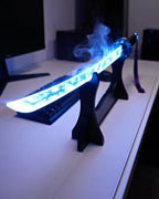 Blue LED mist katana on a gaming desk